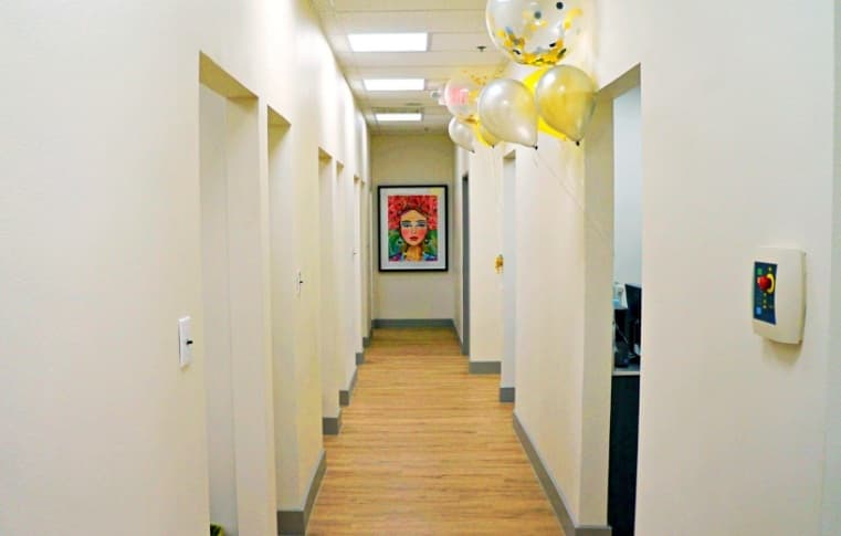 Hallway to the treatment rooms with artwork