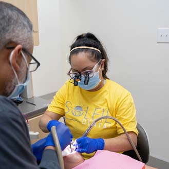 Dental team treating a patient