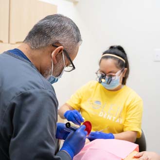 Dental team treating a patient