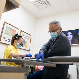 Dental team treating a patient