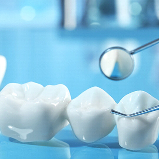 a patient visiting their dentist to receive dentures