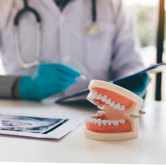 a closeup of dentures resting on table