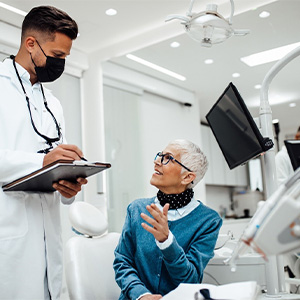 Dental patient talking to her dentist