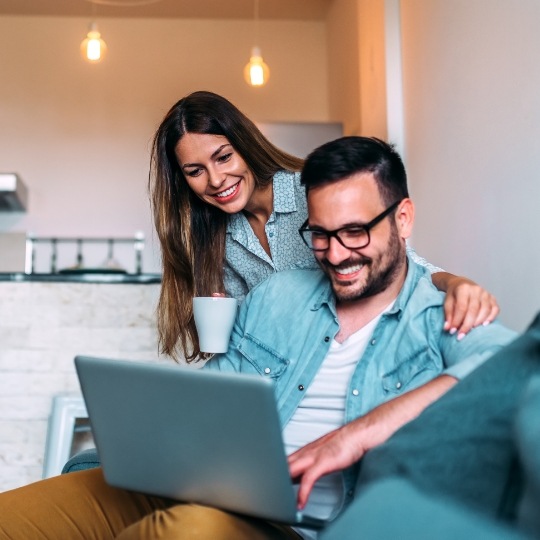 Man and woman reviewing their dental insurance policy