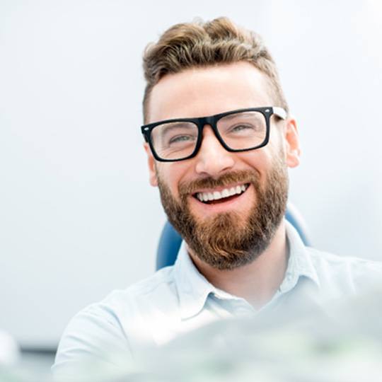 patient smiling after getting Invisalign in Dallas