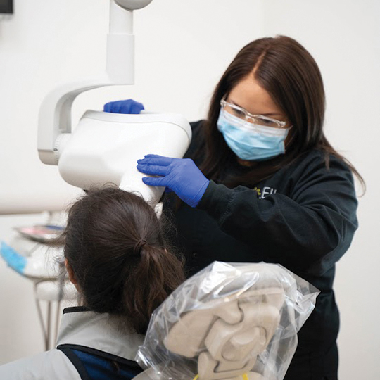 Smiling dental patient in state of the art dental office