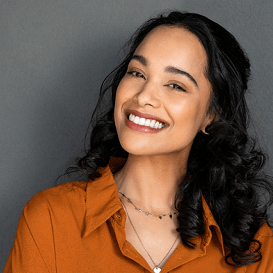 a woman smiling with veneers in Dallas