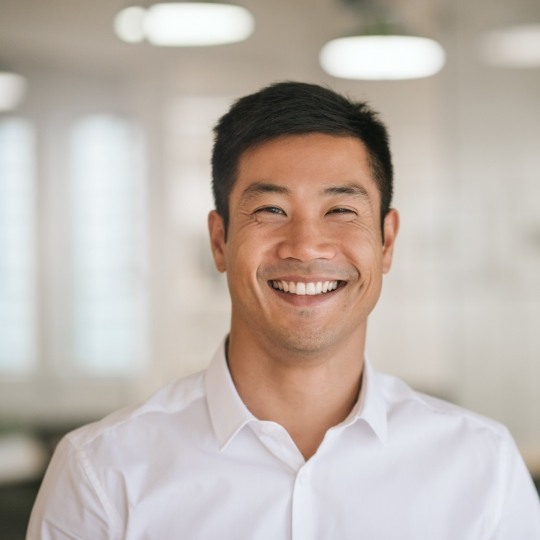 Man smiling after wisdom tooth extraction