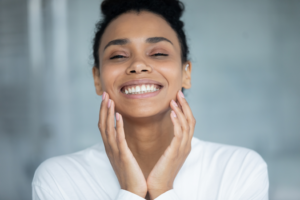 a smiling woman with clear, healthy skin